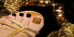 gold and black pedicure with golden sandal, special offers