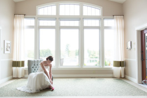 Bride readys herself in sitting room, Mahogany Salon and Spa Ottawa wedding location